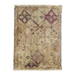 A fragment of a Turkish silk Koum Kapi rug, First quarter 20th century, With stylised floral desi...