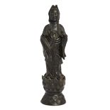 A Chinese bronze Tang-style figure of Guanyin standing, Early 20th century, Cast standing on a lo...