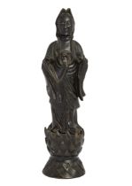 A Chinese bronze Tang-style figure of Guanyin standing, Early 20th century, Cast standing on a lo...