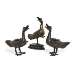 A pair of Chinese bronze duck form censers and a similar parcel gilt censer, Qing dynasty, 18th /...