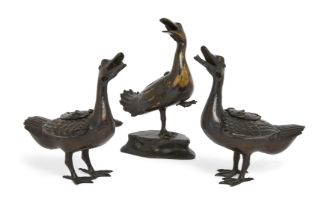 A pair of Chinese bronze duck form censers and a similar parcel gilt censer, Qing dynasty, 18th /...