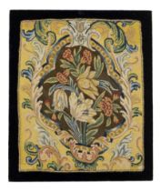 An English needlework fragment, C.1730s and later, Worked in wools, the central cartouche with bl...