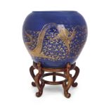 A large Chinese monochrome blue glazed jardinière, Qing dynasty, 19th century, Gilt painted to th...