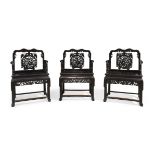 A set of three Chinese hongmu armchairs, Qing dynasty, 19th century, Each with carved back panel ...