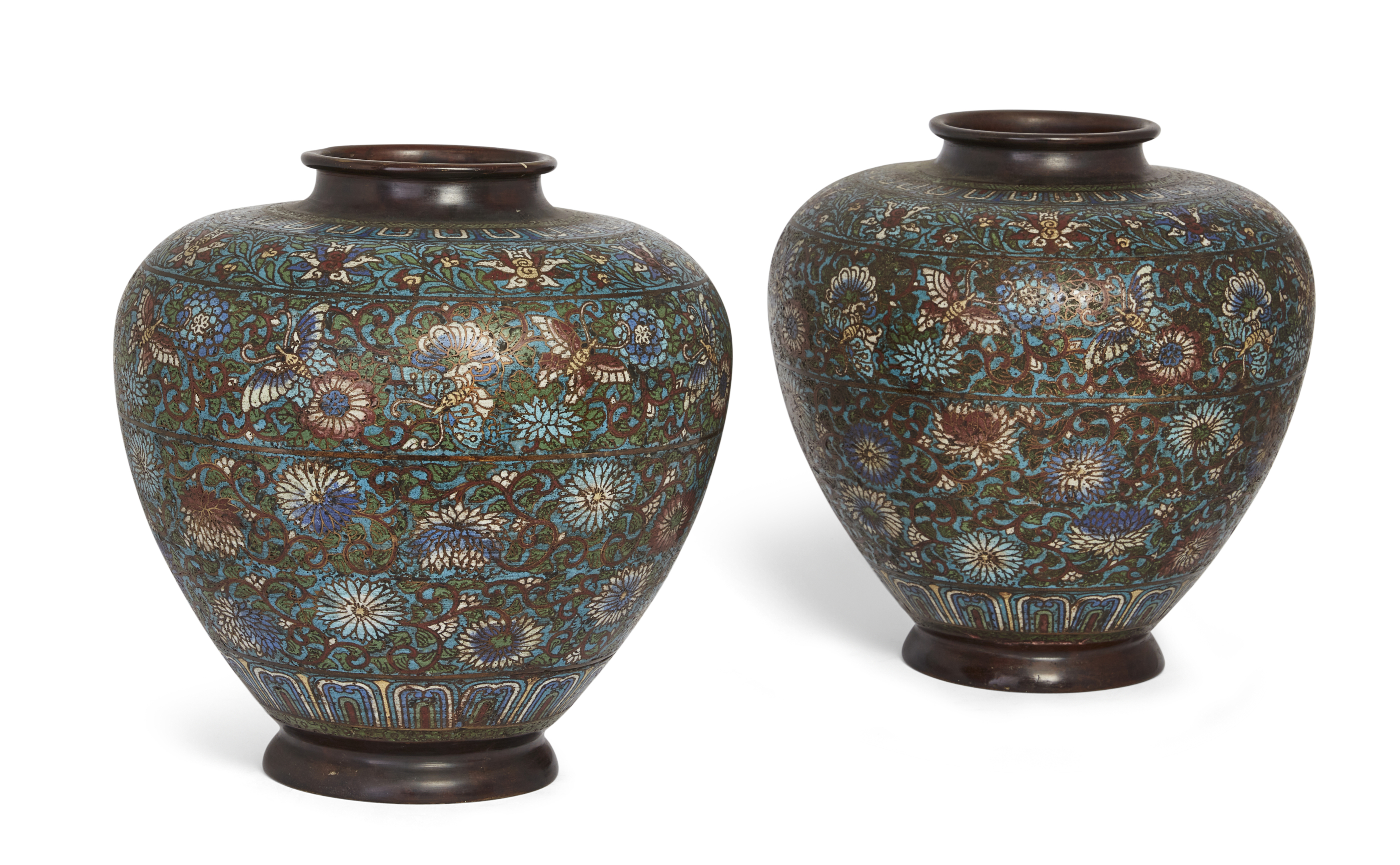 A pair of large Japanese bronze champlevé enamel jars, Meiji period, 19th century, Decorated with...