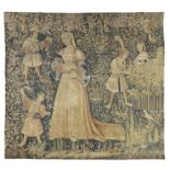 A Franco-Flemish millefleurs tapestry, Early 16th century, A noblewoman stands to centre reading ...