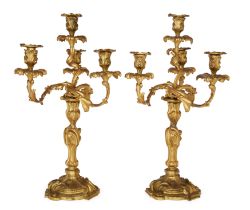 A pair of French gilt-bronze four-light candelabra, Of Louis XV style, second half 19th century, ...