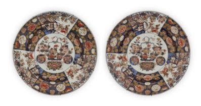 A pair of massive Japanese Imari chargers, 17th century, Each decorated with an ikebana display t...