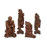 Four Chinese wood carvings figural carvings, Late 19th - early 20th century, One finely carved as...