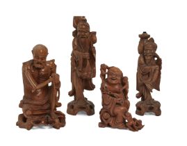 Four Chinese wood carvings figural carvings, Late 19th - early 20th century, One finely carved as...