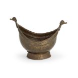 An engraved copper or copper-alloy begging bowl (kashkul),   Iran, 19th century, Of typical form,...