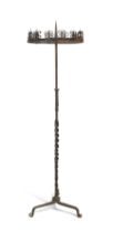 A Spanish wrought iron floor-standing pricket candelabrum, In the Gothic style, some elements pos...