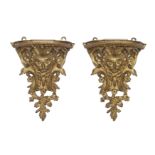 A pair of French gilt-bronze wall brackets, Of Regence style, 19th century, Each with associated ...