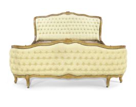 A French walnut framed bed, Of Louis XV style, first half 20th century, With carved floral crest