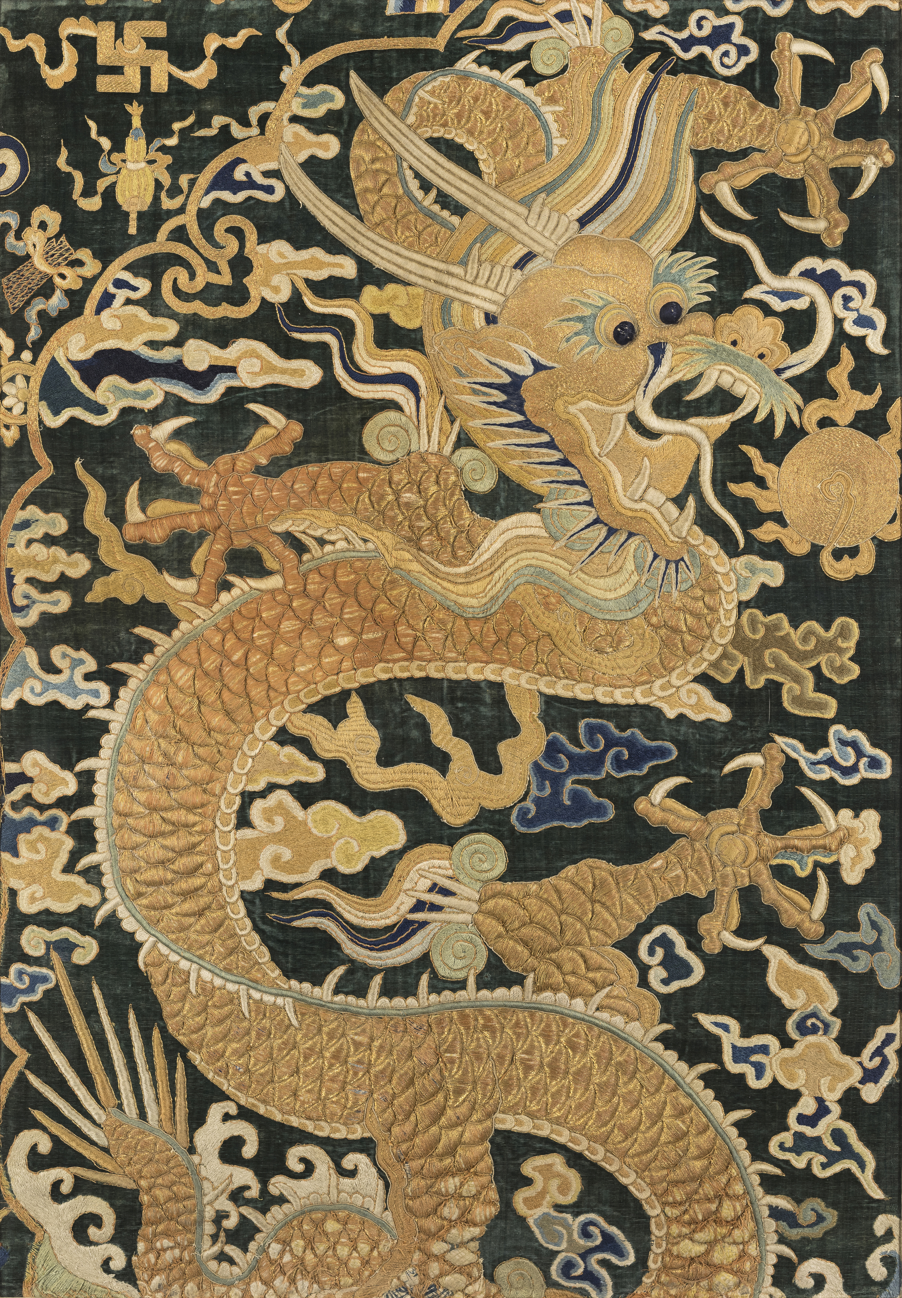 A Chinese silk embroidered dragon panel, Late Qing dynasty, Decorated with a five-clawed dragon i...