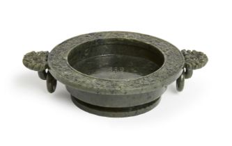 A Chinese spinach jade Qianlong-style 'marriage' bowl,  20th century, With flat broad rim carved ...