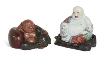 A Chinese famille rose figure of Budai and a Japanese painted plaster figure of Hotei, Republic p...