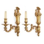 A pair of French gilt-bronze single-light wall appliques, 20th century, Each with urn-shaped back...