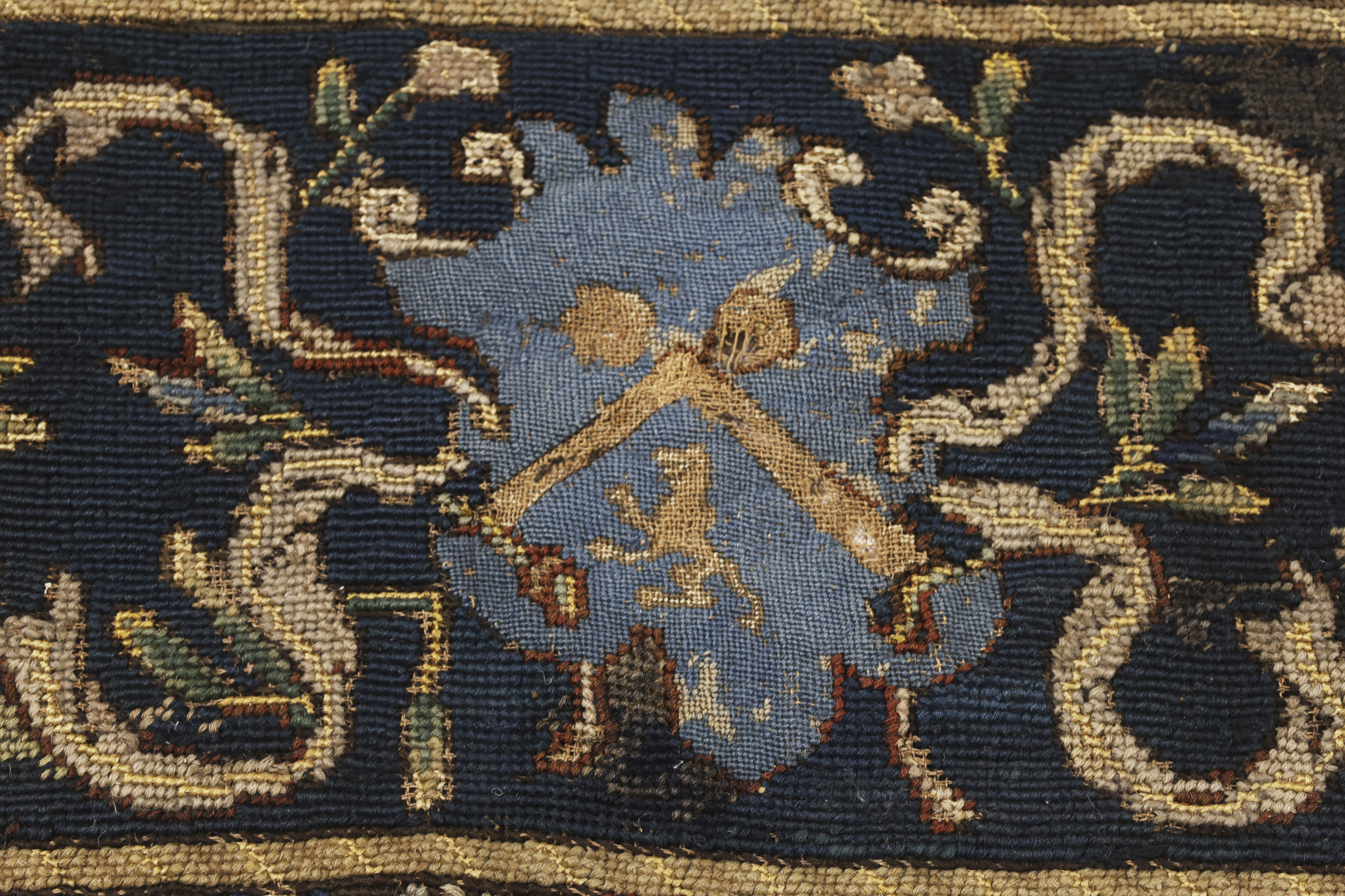 An English needlework table carpet, 17th century, Worked in wools and silks, centred with an oval... - Image 3 of 4