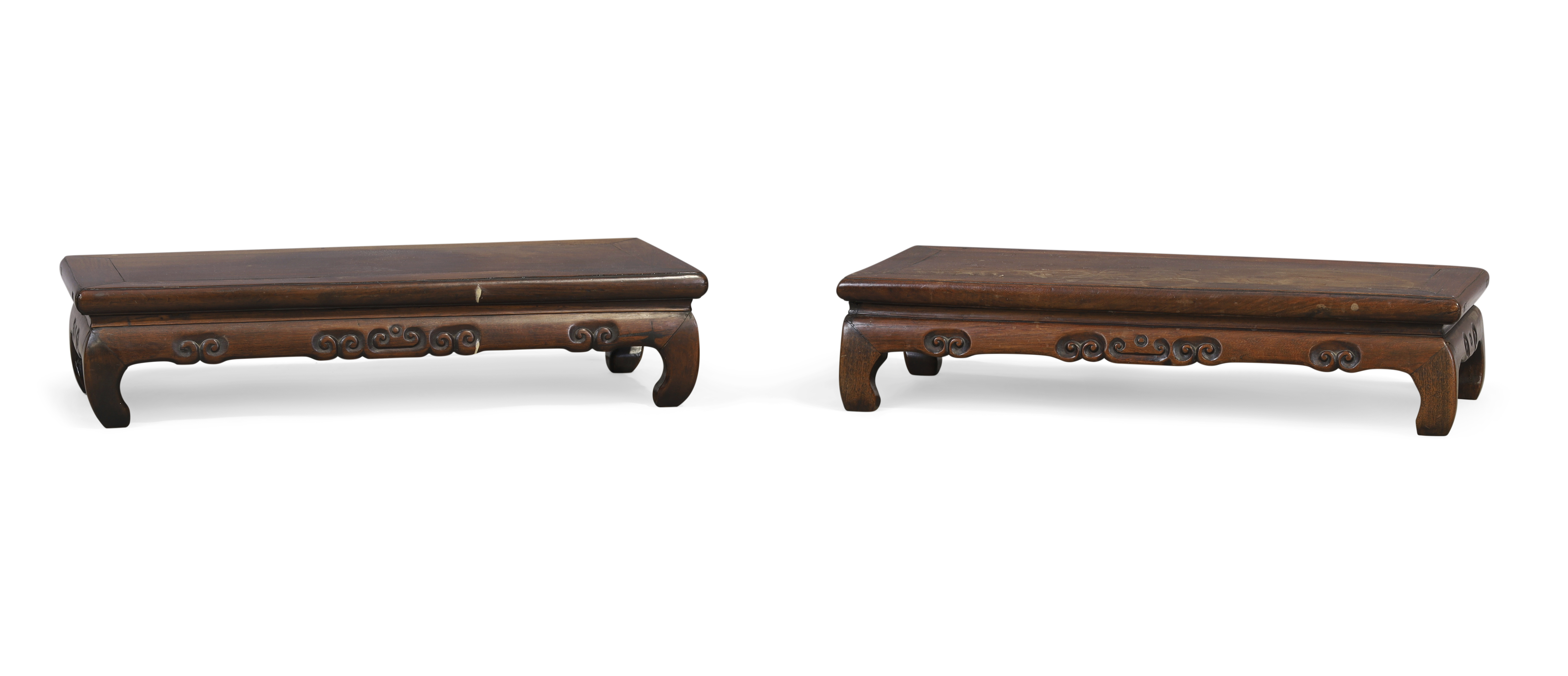 A pair of Chinese hongmu scholar’s stands, Qing dynasty, 19th century, Each formed as a kang tabl...