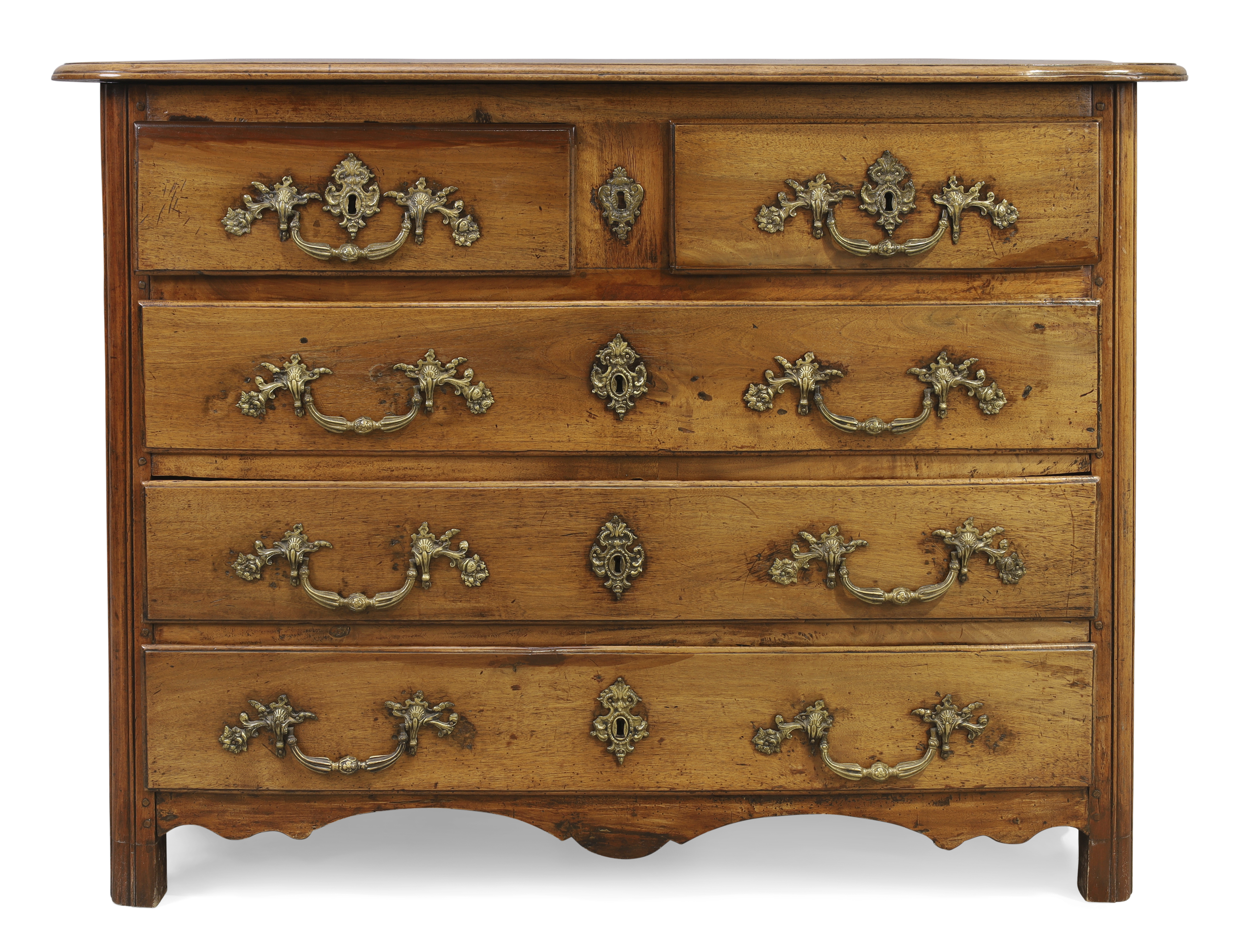 A provincial Louis XV walnut commode, First quarter 18th century, Two short over three long drawe...