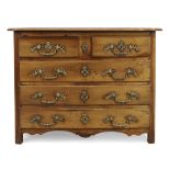 A provincial Louis XV walnut commode, First quarter 18th century, Two short over three long drawe...