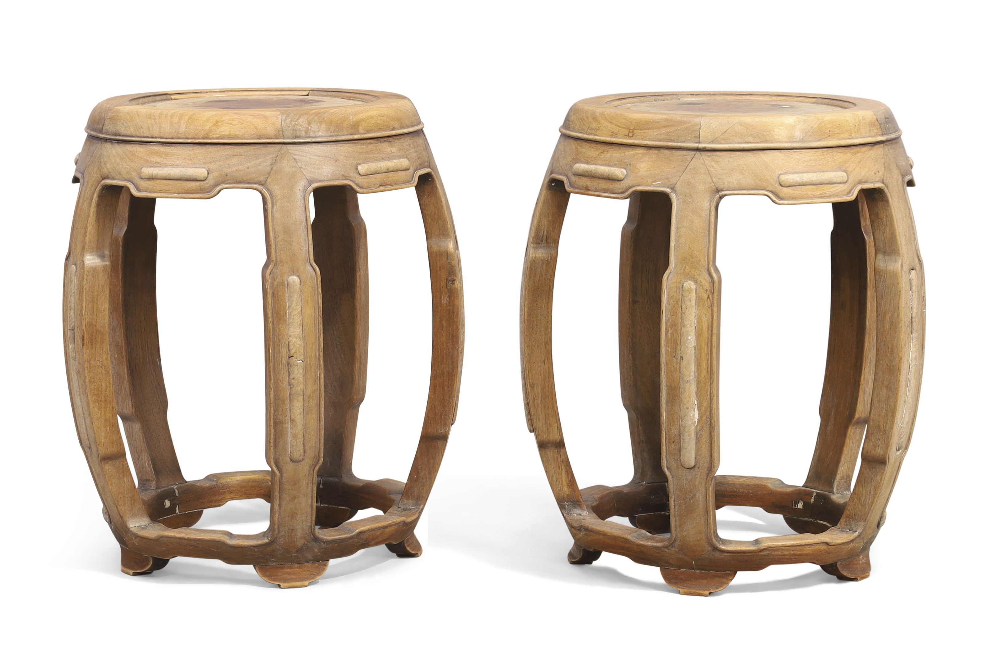A pair of Chinese hongmu barrel form stools, Qing dynasty, 19th century, Each top inset with burl...
