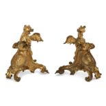 A pair of French ormolu chenets, Of Regence style, 19th century, Each mounted with a dragon, prob...