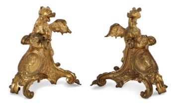 A pair of French ormolu chenets, Of Regence style, 19th century, Each mounted with a dragon, prob...