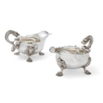 A pair of silver sauce boats with stylised dolphin handles, London, 1930, Richard Comyns, Each de...