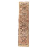 A Persian Mahal runner, Second quarter 20th century,   The central field with stylised floral mot...