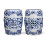 A pair of Chinese blue and white barrel-form stools, 20th century, Pierced with cash motifs to th...