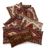 Eleven cushions made from Yamut tent bands, Various sizes, 49 x 39cm and smaller; together with a...