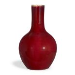 A Chinese copper red bottle vase, tianqiuping, Qing dnasty, mid-19th century, Covered in an even ...