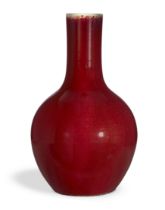 A Chinese copper red bottle vase, tianqiuping, Qing dnasty, mid-19th century, Covered in an even ...