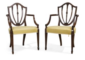 A pair of Victorian mahogany open armchairs, By Wright & Mansfield, of Hepplewhite design, third ...