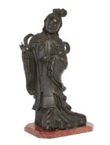 A large Chinese bronze figure of an immortal, Late 19th century, Depicted standing holding a peac...