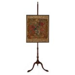 An English mahogany pole screen with needlework panel,  Mid-18th century and later stand, The adj...