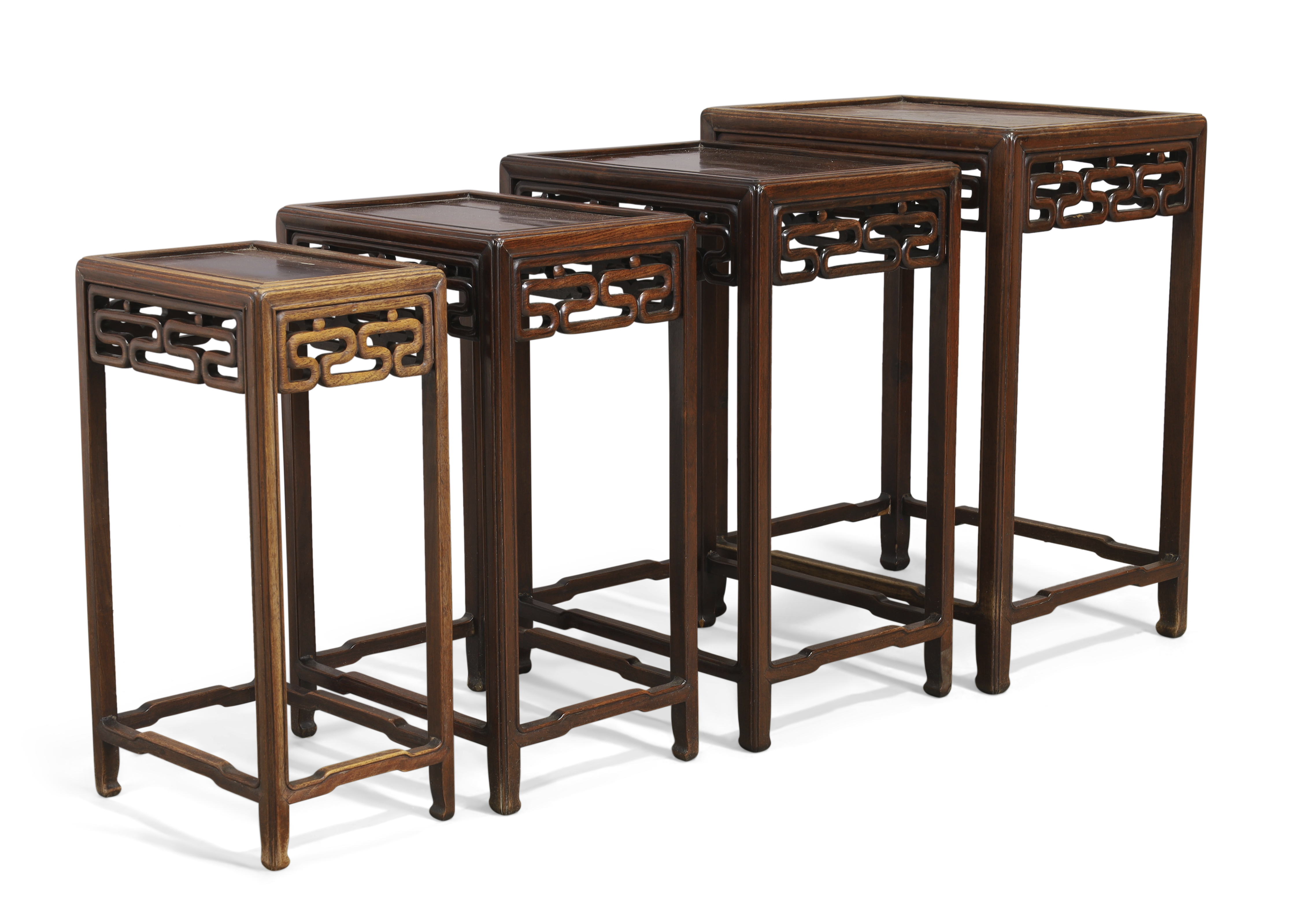 A Chinese hongmu quartetto of occasional tables, Qing dynasty, 19th century, Each with pierced sc...