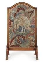 A English mahogany firescreen, Early 20th century, Inset with an 18th century and later needlewor...