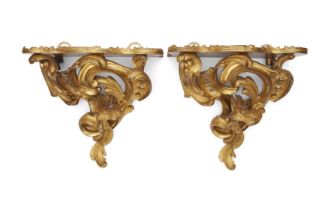 A near pair of French gilt-bronze wall brackets, Of Louis XV style, 19th century, Each with a pro...