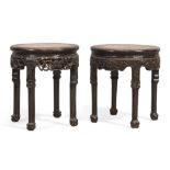 A pair of Chinese hongmu circular stools, Qing dynasty, 19th century, The circular marble inset t...
