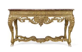 A Regence giltwood console table, First quarter 18th century, The marble top above carved frieze ...