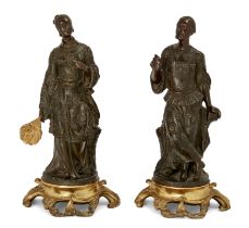 A pair of French bronze Chinoiserie figures, Mid-19th century, The male and female figures each s...