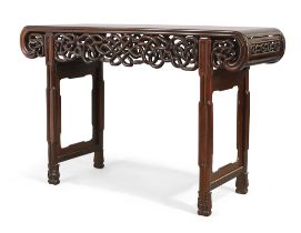 A Chinese rosewood scroll table, Qing dynasty, Daoguang period, The rectangular top above reticul...
