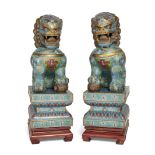 A pair of large Chinese cloisonné and gilt metal Buddhist lions,  20th century, Each modelled sea...