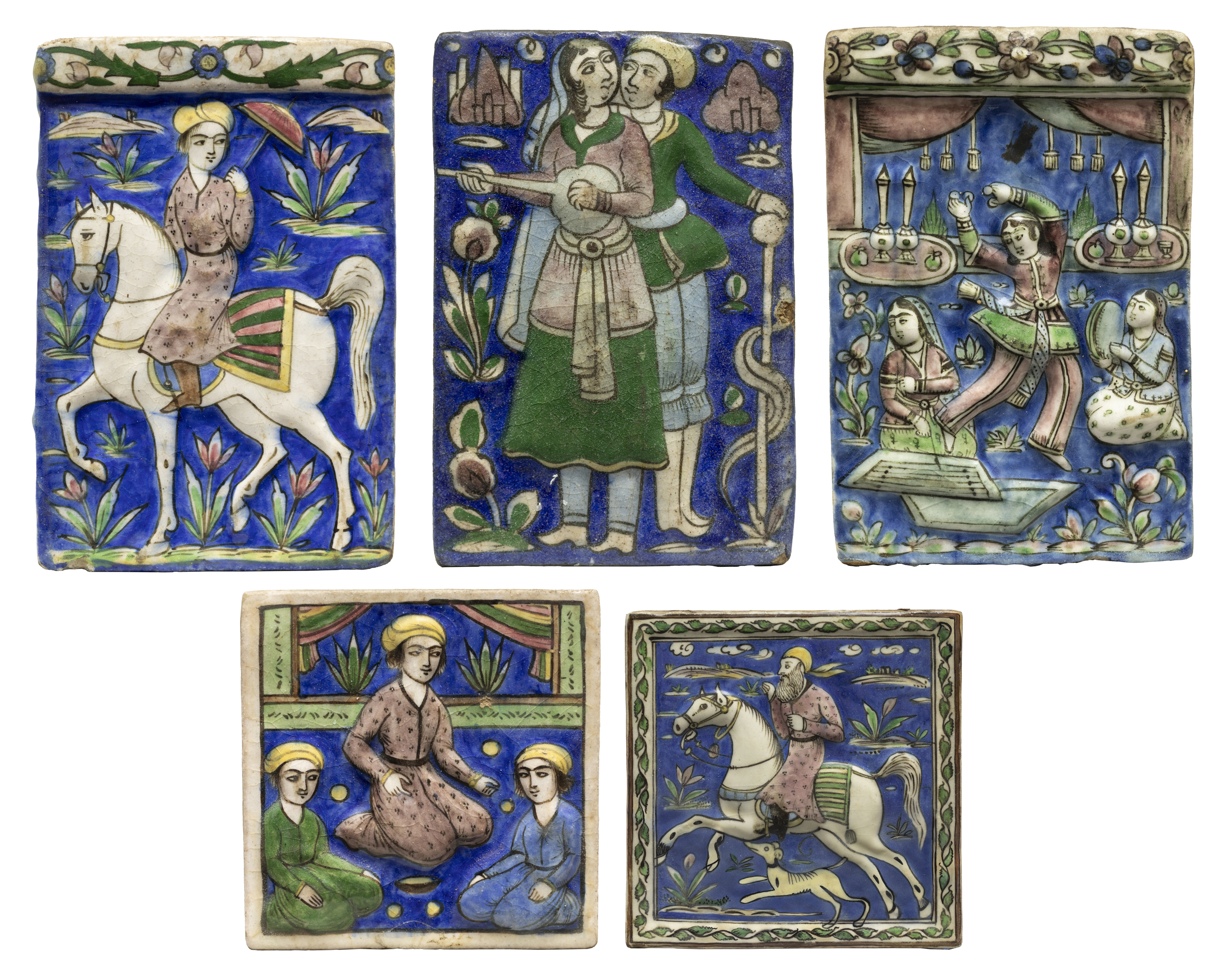 Five figural polychrome moulded pottery tiles, Qajar Iran, c.1890, The first of rectangular form ...