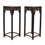 A pair of Chinese hongmu square jardinière stands, Qing dynasty, 19th century, The square marble ...