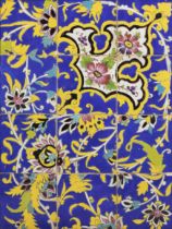 A large polychrome pottery tile panel, Qajar Iran, late 19th century, The blue and turquoise blue...