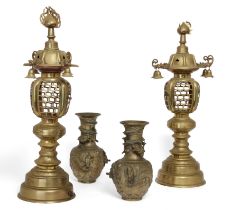 A pair of Japanese bronze pagoda lanterns and a pair of Chinese brass vases, Late 19th century, T...